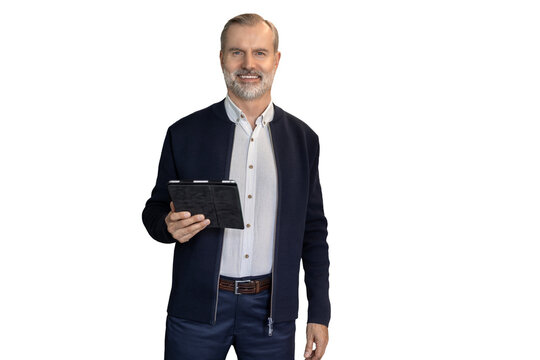 Modern business man in formalwear using digital tablet while standing on a transparent background