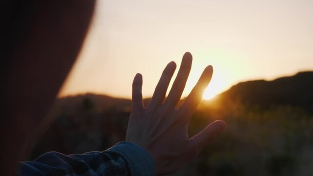 Person embracing serene contemplation with outstretched hand towards a