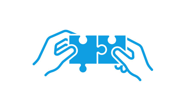 Hands connecting two puzzle pieces, symbolizing teamwork and solutions