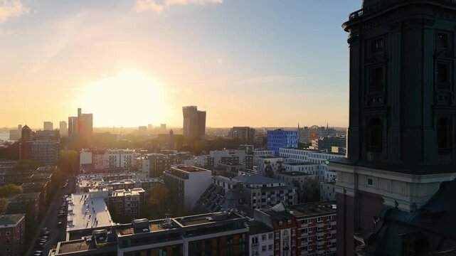 Aerial view of the Hamburg city skyline featuring modern architecture and rooftops at sunset near St. Michaeliskirche, Hamburg, Hamburg, Germany.
