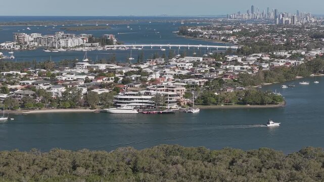 Scenic Broadwater With View Of Ephraim Island And Bridge, And Surfers Paradise Skyline In Distance. aerial pullback shot