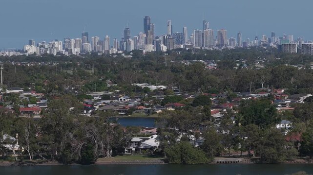 Surfers Paradise Skyline From Coastal Suburb In Gold Coast, Queensland, Australia. wide drone shot
