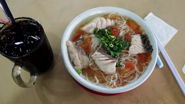 Sabah fish vermicelli noodle tomato soup is a famous Sabah food