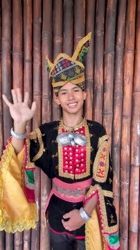 Young man wearing complete set of Dusun Tindal Clothes Sinipak during Kaamatan Harvest Festival in Sabah