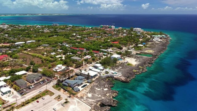 North West Point, Cayman Islands: Aerial view of turquoise Caribbean sea, tropical coastline and reef off Grand Cayman - landscape panorama from above

