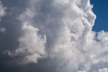 Obraz premium Fluffy white clouds on blue sky in Israel. 