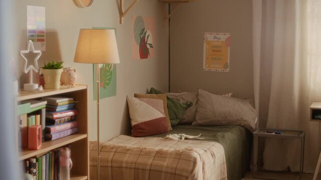 Establishing shot of empty child bedroom with bed, bookshelf, and lamp. Footage serving as perfect background for real estate marketing or interior design advertising