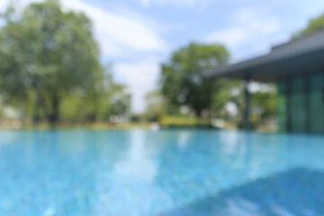 Fototapeta premium Abstract blur outdoor swimming pool in tropical resort hotel summer background