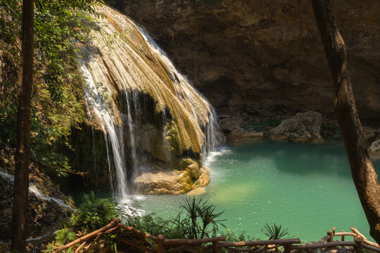 The beautiful turquoise waterfall is located in Ko Kluang National Park, Li District, Lamphun Province, in northern Thailand.