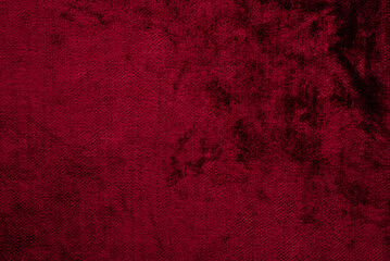 Obraz premium Dark red purple crushed velvet texture background, luxury burgundy velour fabric with soft shiny pattern.