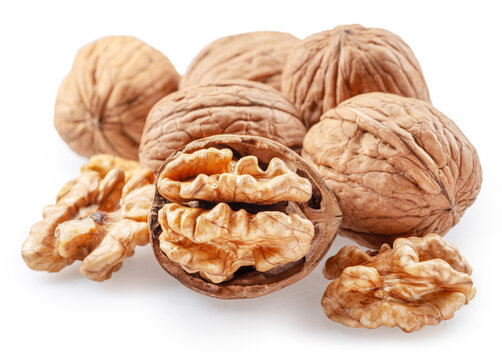 Whole walnuts and peeled walnut half isolated on white background, clipping path.