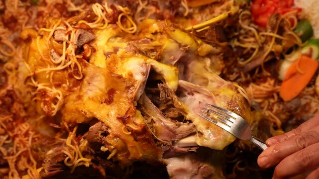 Pulling Apart Fully Cooked and Flawlessly Tender Lamb Mandi Meat with a Fork, Prepared Using the Traditional 3-Hour Saudi Method
