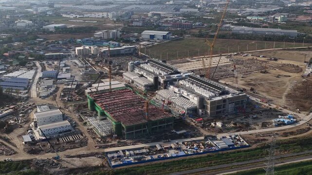 Aerial drone view of a data center under construction in Chonburi, Thailand, showcasing hyperscale AI infrastructure, cloud computing systems, and large scale IT technology development.