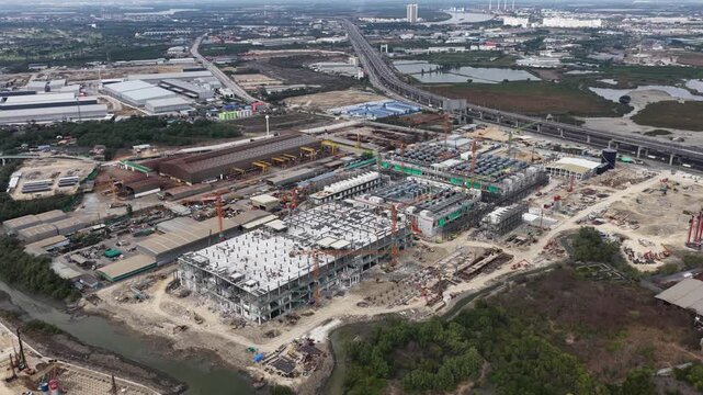 Aerial drone view of a data center under construction in Chonburi, Thailand, showcasing hyperscale AI infrastructure, cloud computing systems, and large scale IT technology development.