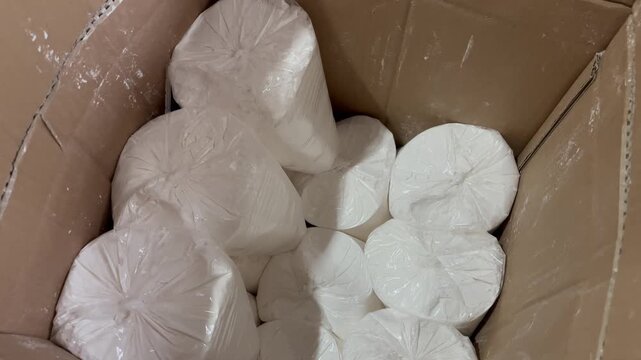 Wheat flour in plastic packaging inside cardboard box