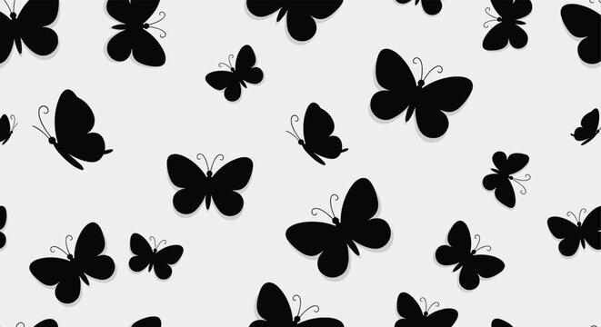 A seamless pattern of black butterfly silhouettes on a light gray background for design and decoration purposes in various creative projects