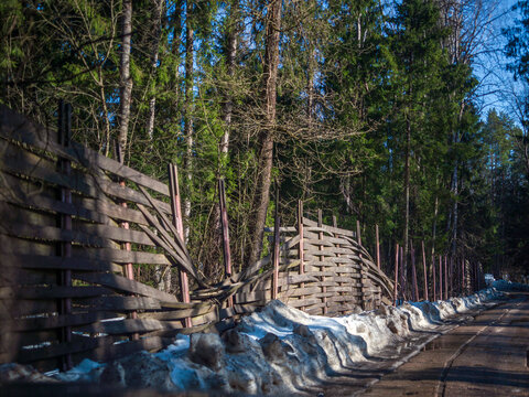 seriously damaged wooden fence