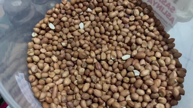 Raw peanuts background, close up raw organic peanuts