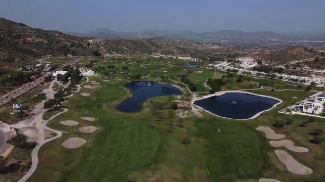 Aerial overview of the Font del Llop golf course and arid surroundings. Monforte del Cid, Spain.