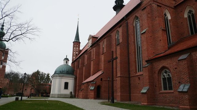 Tilt down over the Archcathedral Basilica of the Assumption of the Blessed Virgin Mary and St. Andrew in Frombork, Poland.