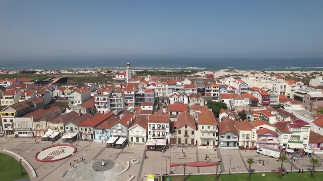 Costa Nova Striped Houses. Aerial drone Shot of colourful Buildings along Costa Nova do Prado beach, Aveiro, Portugal.