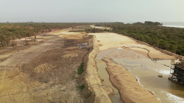 aerial view open pit zircon mine in Abene in Sengal in Africa, exploitation of resources in natural protected area