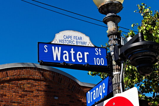 A street sign in Wilmington identifying the intersection of Water Street and Orange Street.