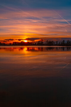 Summer sunset or sundowner view with reflections near Plattling, Isar, Deggendorf, Bavaria, Germany