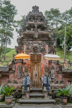 Indonesian statue in a temple with offerings