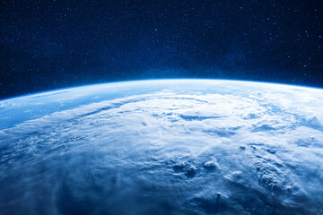 Obraz premium Breathtaking view of planet Earth from space, featuring a massive hurricane system, white clouds, and blue oceans under a clear, starry atmosphere