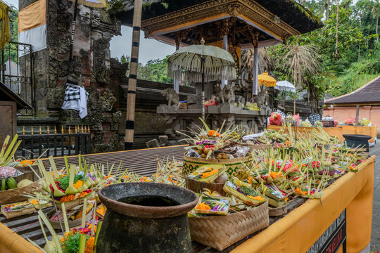 Indonesian statue in a temple with offerings