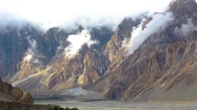 Majestic Karakoram Mountain Landscape Featuring Glacier Formations and Lush Green Settlements