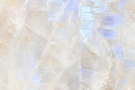Luxury Moonstone Crystal Texture Background with Soft Iridescent Blue Glow