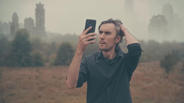 Man with smartphone in foggy post‑apocalyptic abandoned city, lost and cut off from civilization