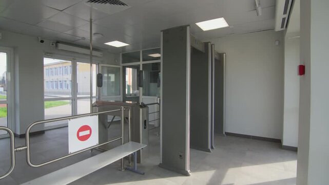 Access control systems like detectors and speed gates regulate flow in facility entrance. Security infrastructure provides safety checks