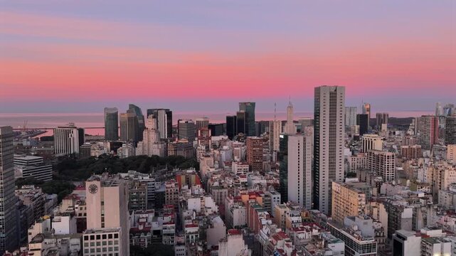 Aerial Drone Pan of Buenos Aires City Skyline at Pink Sunset with Puerto Madero Background