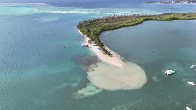 High angle aerial drone view of the No Man's Land sandspit in Tobago. White sand meeting turquoise Caribbean waters and lush green mangroves in a tropical paradise in Trinidad and Tobago.