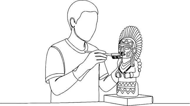 Person carefully repairing an ancient artifact statue indoors.