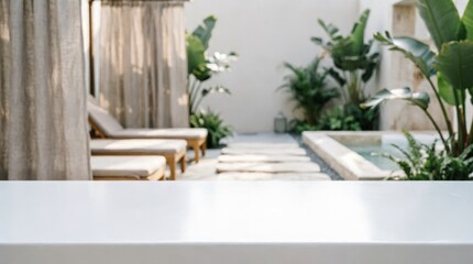 Obraz premium Luxury Outdoor Spa Courtyard with Lounge Chairs and Plants for Wellness Design