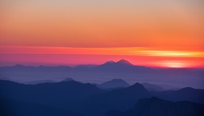 Obraz premium The Horizon Is Painted In Delicate Shades Of Pink And Orange As The Sun Sets Behind Distant Mountains