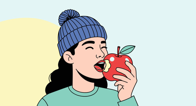 Woman eating a red apple with blue hat and smiling against soft background