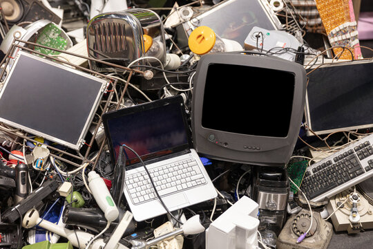 Pile Of Discarded Electronic Waste Including Laptop Television Keyboard And Other Obsolete Devices For Recycling And Environmental Concepts