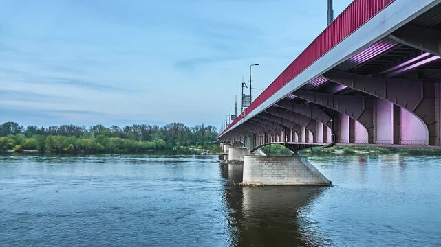 WARSAW, POLAND - APRIL 15 2018: Slasko-Dabrowski Bridge is a bridge over the Vistula River in Warsaw. It was built from 1947 to 1949 on the pillars which remained from the Kierbedzia Bridge.