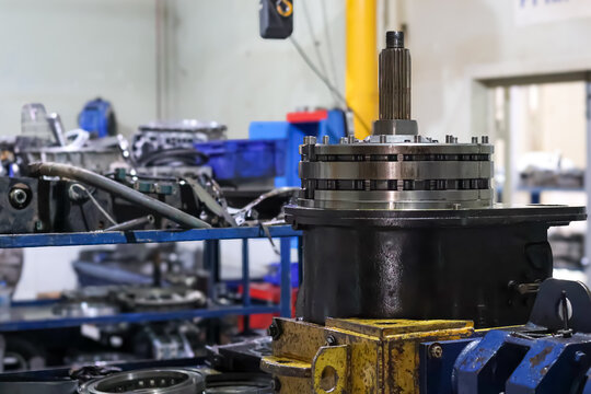 Allison transmission gearbox assembly on a workstation during maintenance process in a professional workshop.