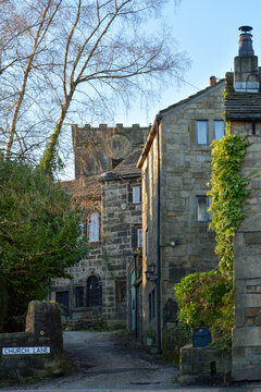 Church Lane in Heptonstall village with beautiful old stone housed in front of the historic medieval ruins of St Thomas a Becket church