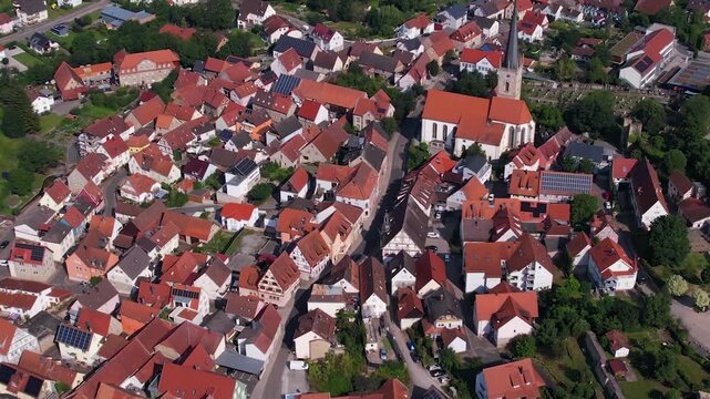 Aerial view above the old town of the city Gr&uuml;nsfeld in Germany on a sunny summer noon