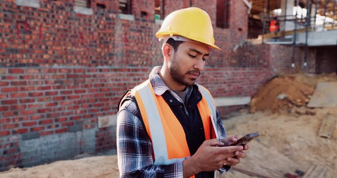 Engineer, man and inspection at construction site with phone, text message and update for project. Person, typing and tech outdoor with engineering feedback, quality assurance or building renovation.