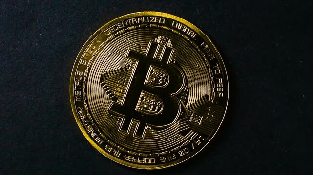 Bitcoin Rotating on Black Background close up