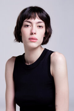 Sophisticated Young Woman with Pixie Cut Showcasing Contemporary Fashion Look