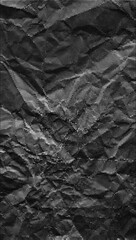 Naklejka premium Black crumpled paper halftone dotted vertical background. Vector abstract grainy textured distressed dark paper for collages, banners, presentations